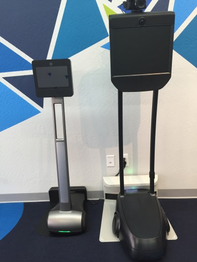 Consumer-level Beam+ on left, BeamPro on right.  Docking stations on floor